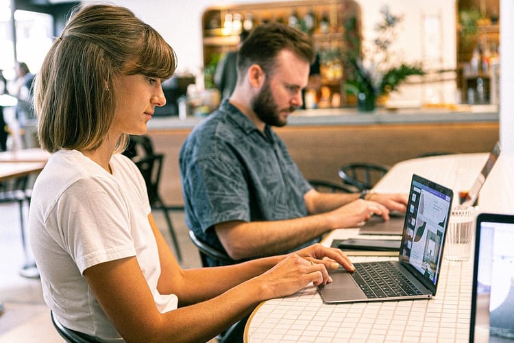 photo of woman using laptop - best freelance websites in the U