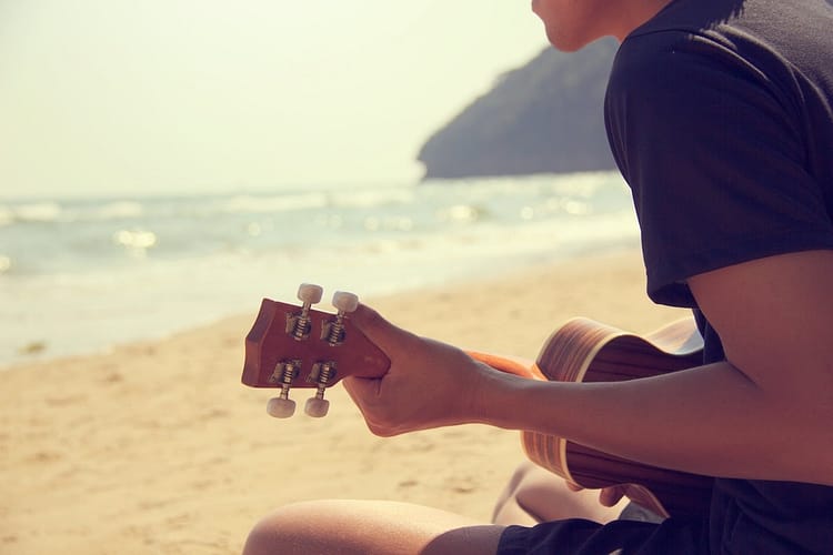 person playing ukulele - ukulele tips