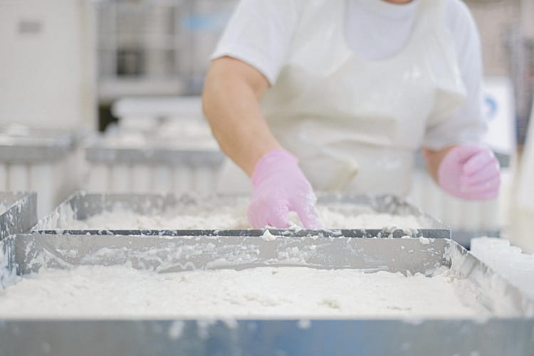 a person waring gloves at work