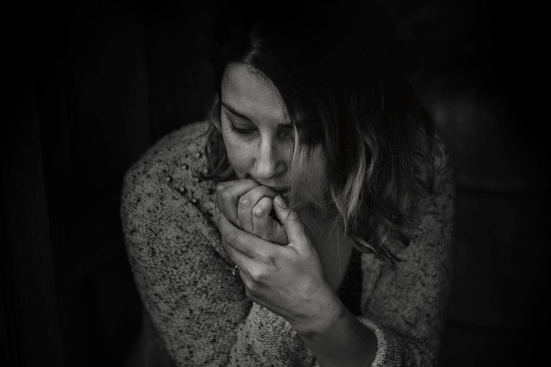 greyscale photography of woman wearing long sleeved top coping with anxiety.