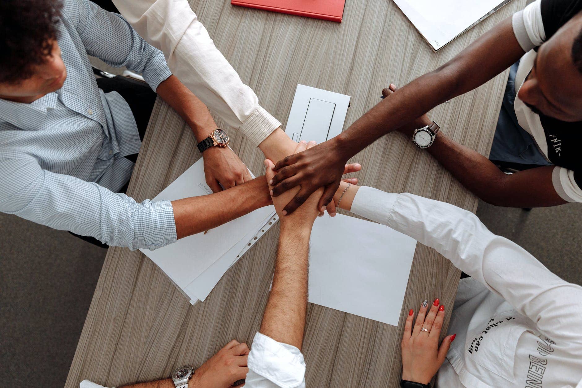 man and woman holding each other s hands as a team - thriving business