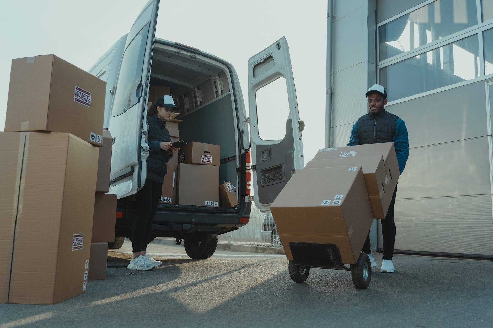 a man and a woman working for a logistics business