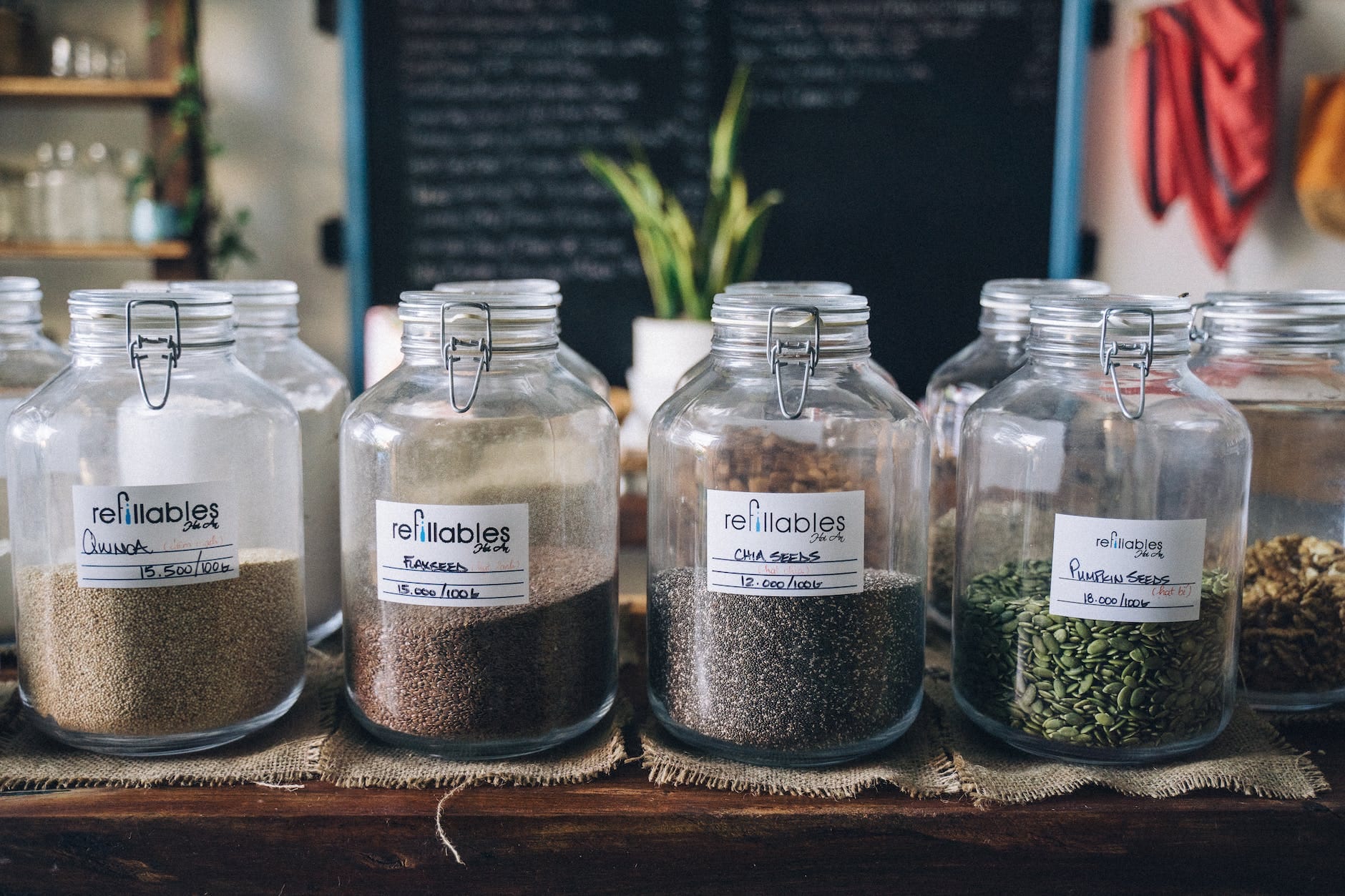 assorted seeds in glass jar containers - mindful consumption 