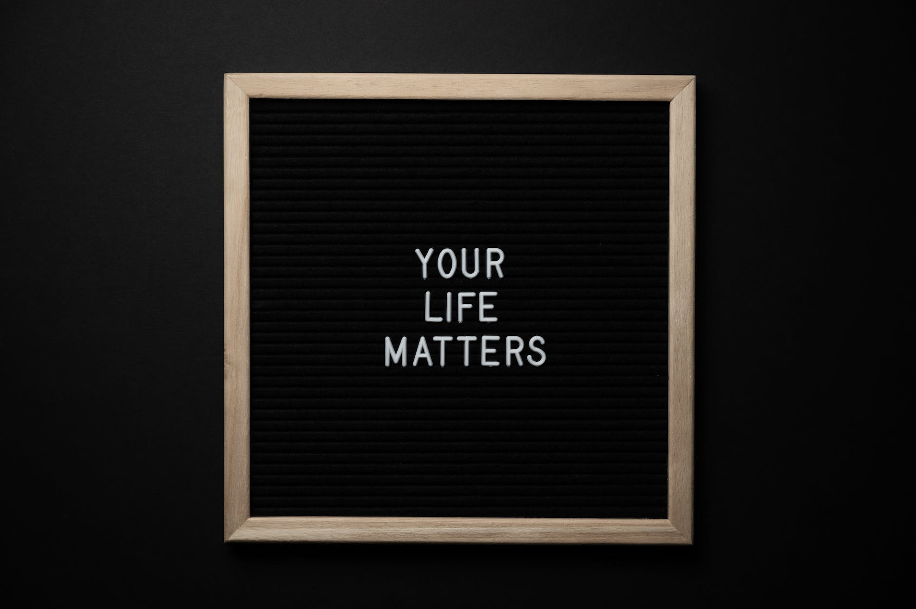 blackboard with your life matters inscription on black background - what is slow living?