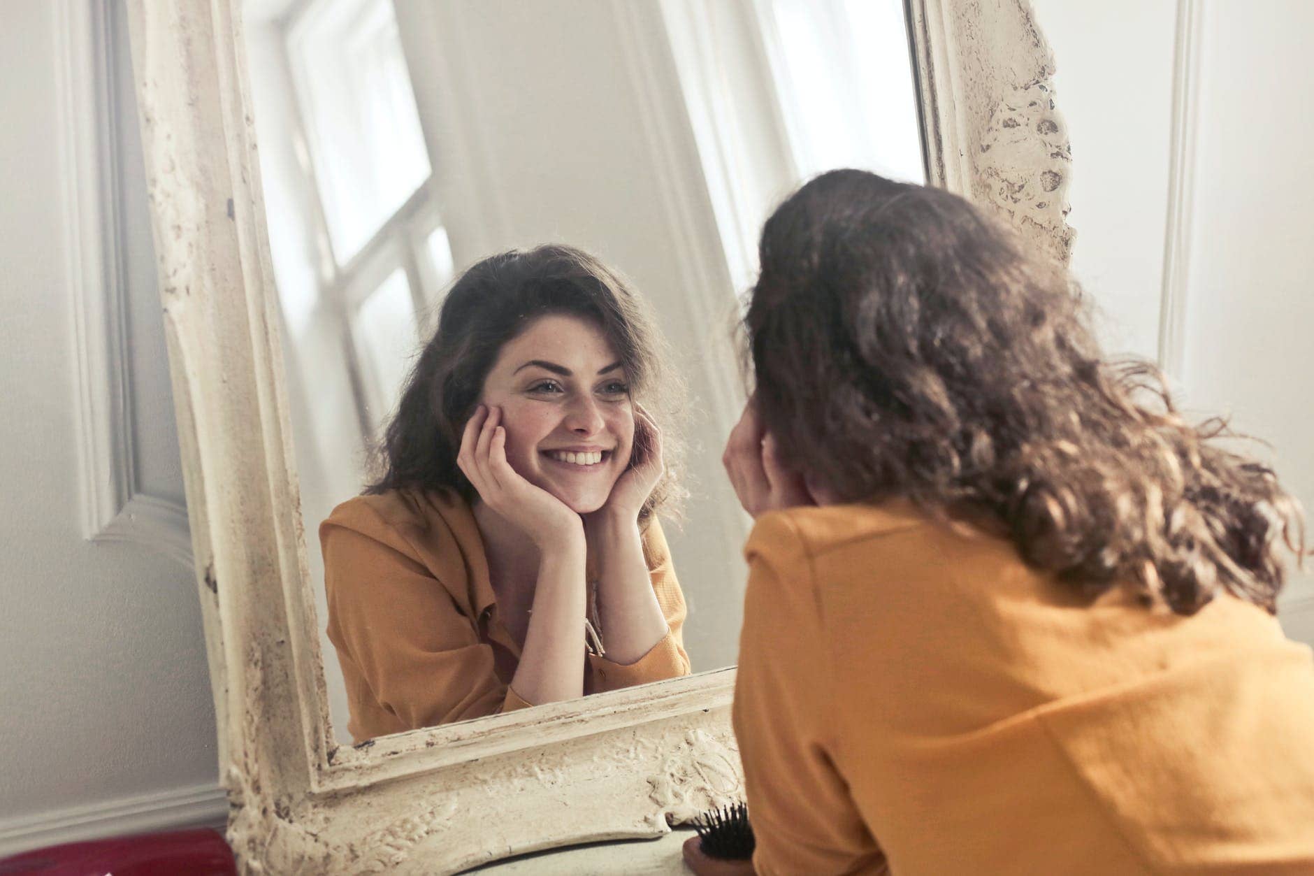 photo of woman looking at the mirror - mental health checklist