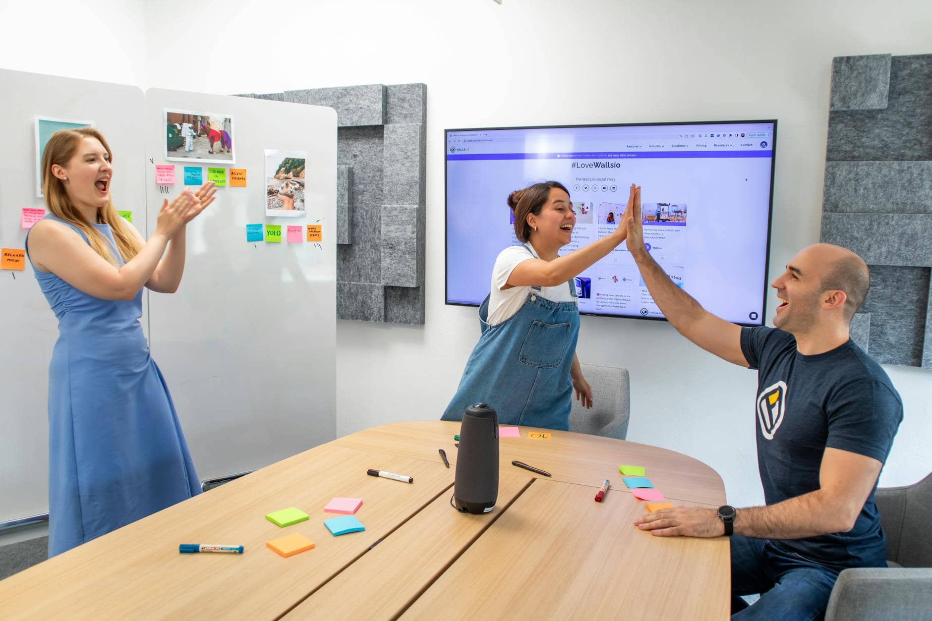 people in an office celebrating business success