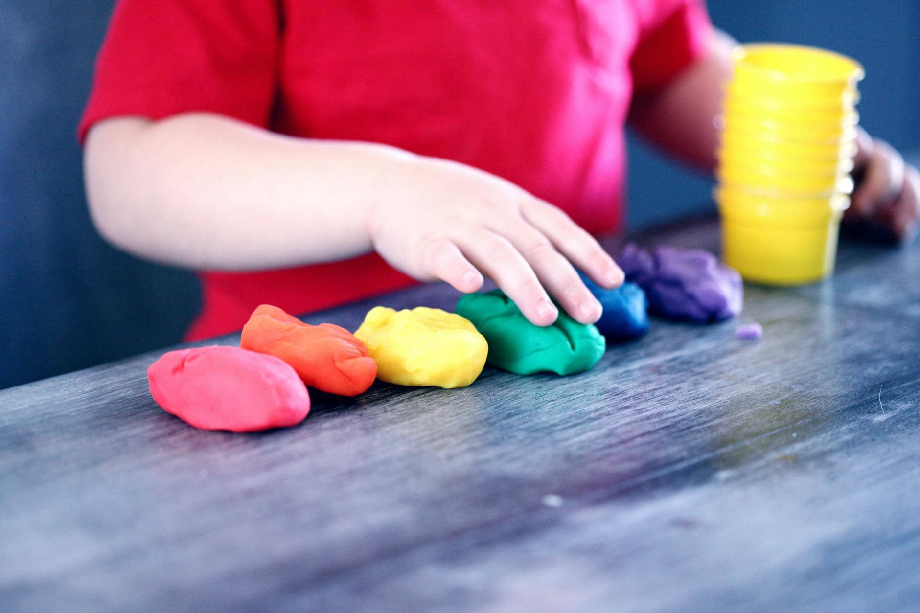 person making clay figures - Childminding work