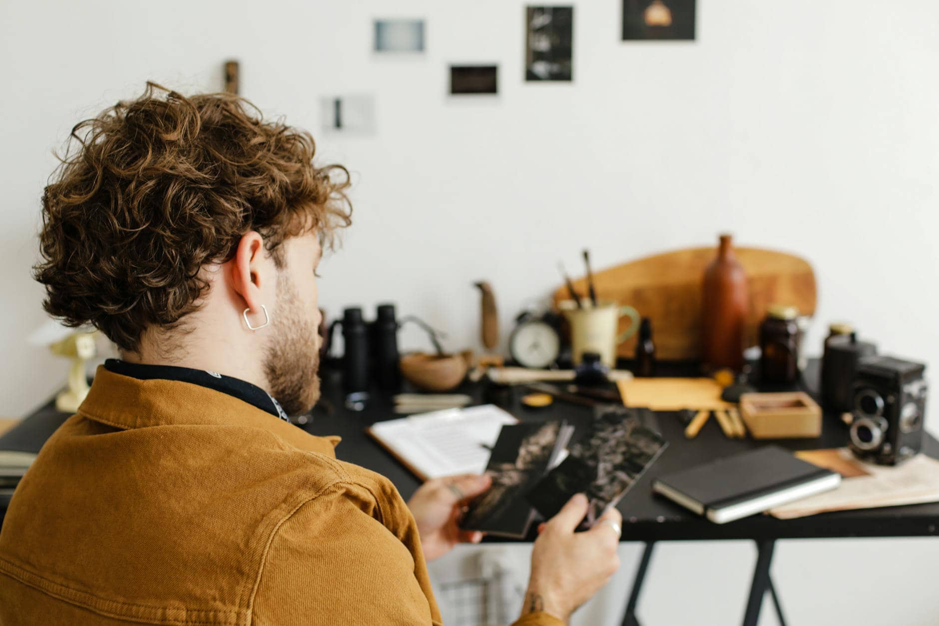 a man holding photographs