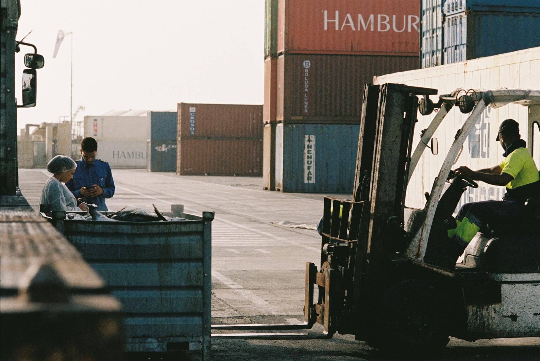 forklift and containers at a transshipment port