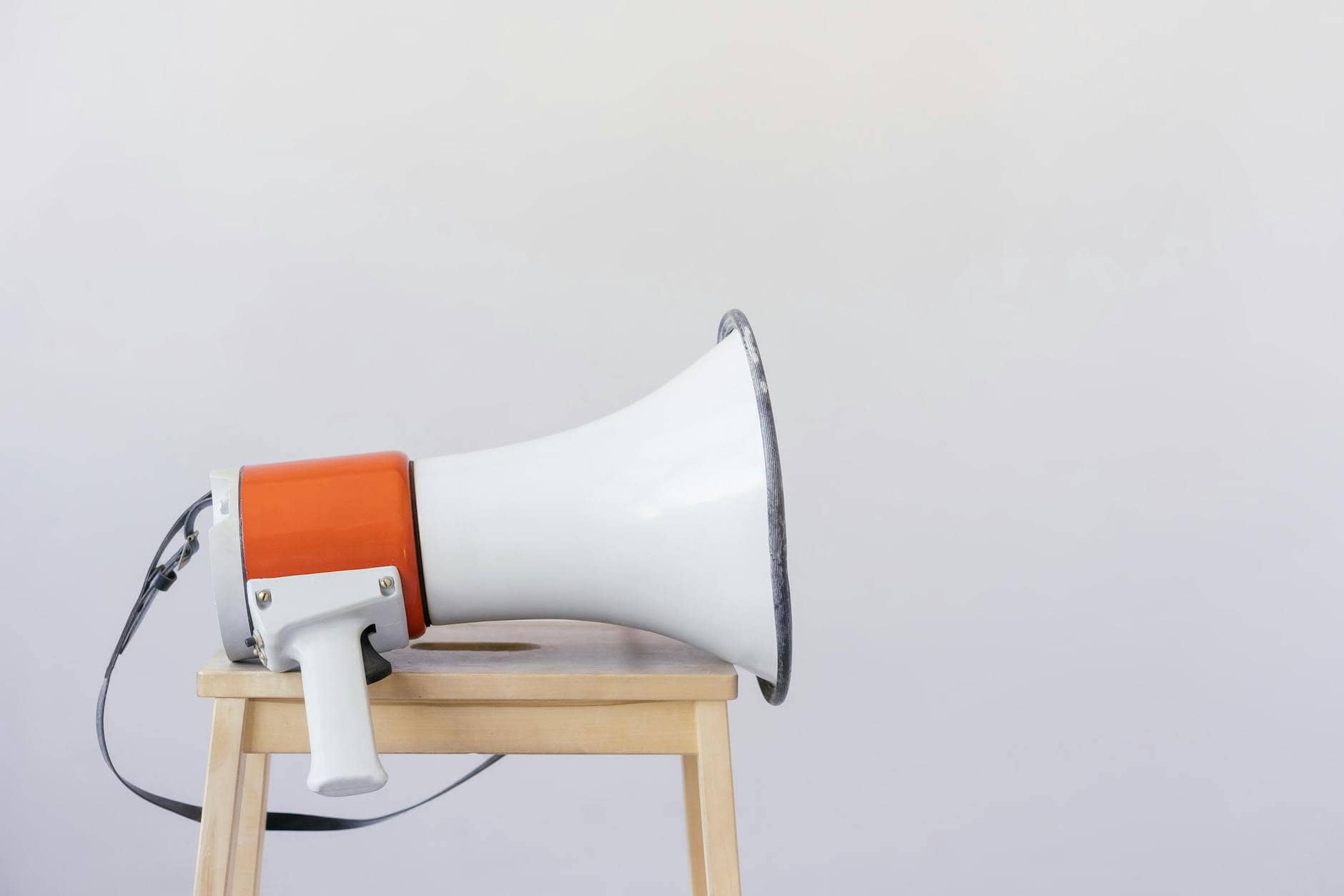 loudspeaker on top of wooden chair