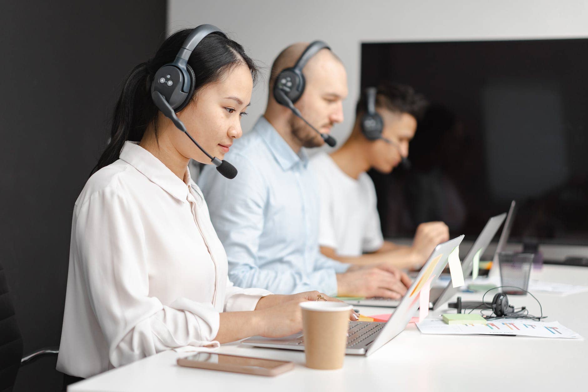 shallow focus of woman working in a call center - improve your customer service