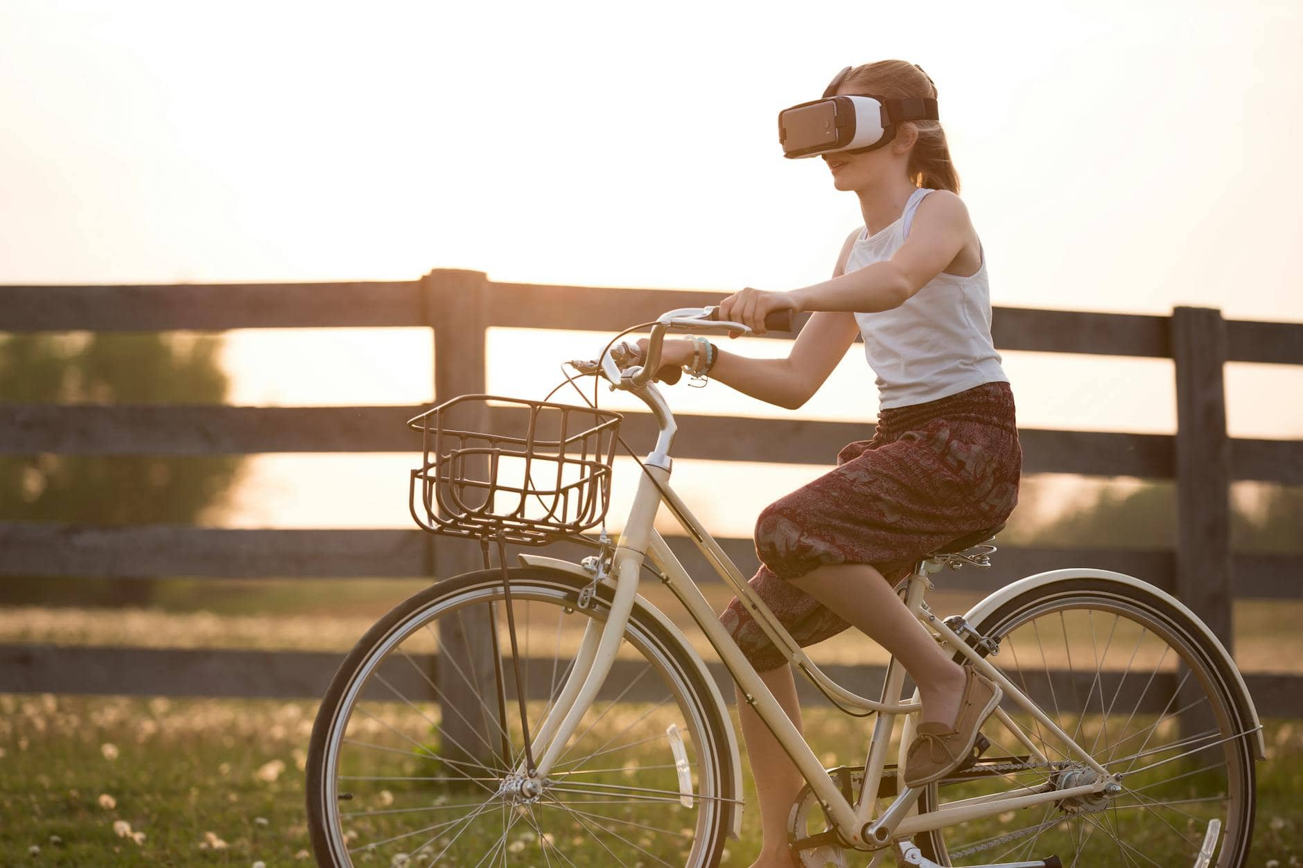 girl wearing vr box driving bicycle during golden hour
how does virtual reality work?