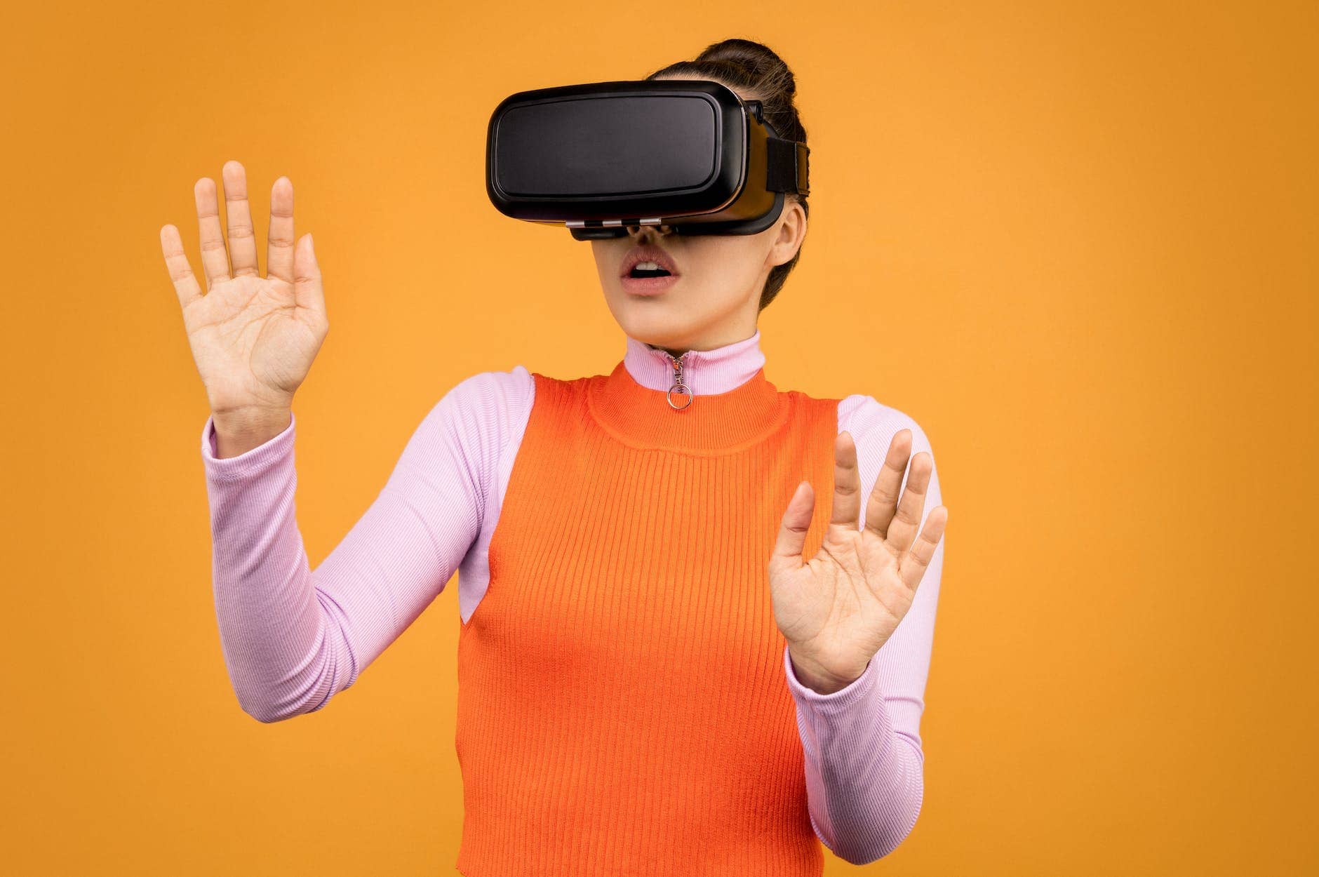 woman in long sleeve shirt wearing vr goggles - How does virtual reality work?